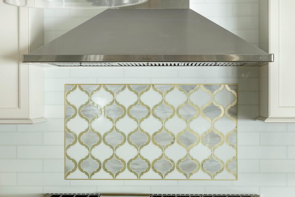 close up picture of kitchen backsplash and hood
